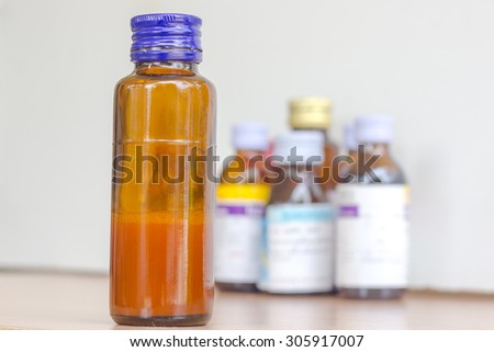 syrup bottle with syrup bottles background