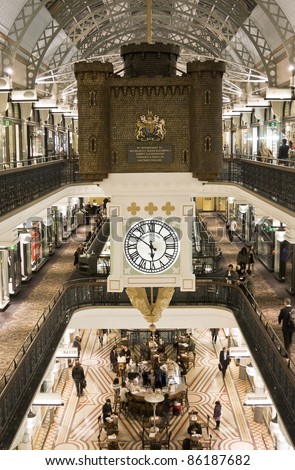 SYDNEY, AUSTRALIA - JULY 1: A hanging clock inside the Queen Victoria Building shows time on July 1, 2011 in Sydney. The QVB is a high-end shopping precinct in Sydney and a famous tourist attraction.