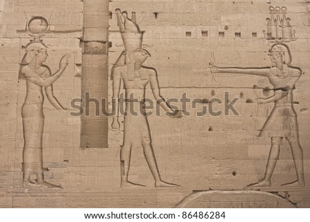 Frieze on the wall of Egypt’s Philae temple: Pharaoh’s offering to the Gods Horus and Hathor