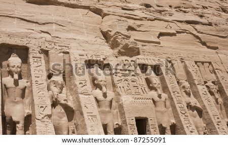 Engraved statues of King Ramses II and Queen Nefertari on the wall of the Queen’s temple in Abu Simbel, Egypt