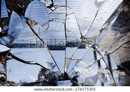 Broken mirrors make a beautiful reflection in the sun, left in the desert amongst trash and found pieces of art and garbage.