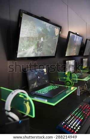 E3; The Electronic Entertainment Expo at the Los Angeles Convention Center, June 16, 2015. Los Angeles, California. Neon keyboards and headphones on display.