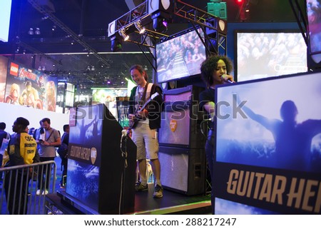 E3; The Electronic Entertainment Expo at the Los Angeles Convention Center, June 16, 2015. Los Angeles, California. The Guitar Hero game demo allowed players to become rock stars for a while.