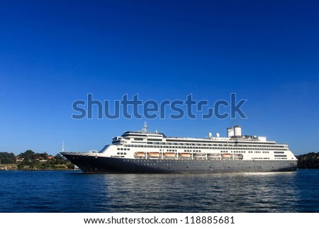 Large cruise ship under blue sky
