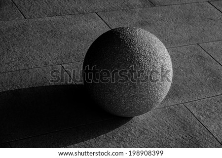 stone sphere in light and shadow