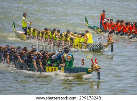HONG KONG - JUNE 27, 2015 : During the annual Dragon Boat Festival, three fishermen's associations in Tai O organise a religious ritual known as The Dragon Boat Water Parade of Tai O