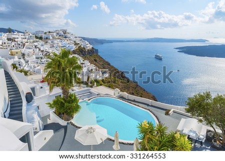 White architecture at Santorini(Thira) island. Swimming pool in luxury hotel. Beautiful view on the mediterranean sea,caldera and vulcano.Santorini (Thira) island.Cyclades.Greece.Europe.