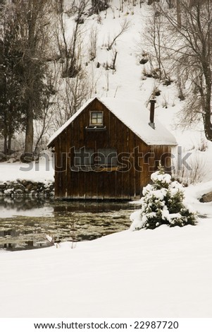 Cabin in the mountains during a snow storm