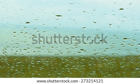 Rain on the window looking out to sea