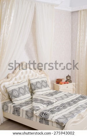 Bed in an interior with a canopy