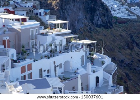 Restaurant on the cliff of  Greek island beside  blue Aegean sea , Santorini, Greece