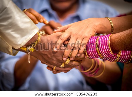 Bride and Groom Joining Hands During an Indian Wedding Ritual