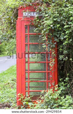 Vintage British red k6 telephone box in a rural village in West Sussex, UK