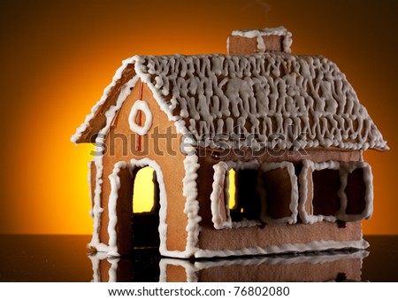 Gingerbread house on orange background