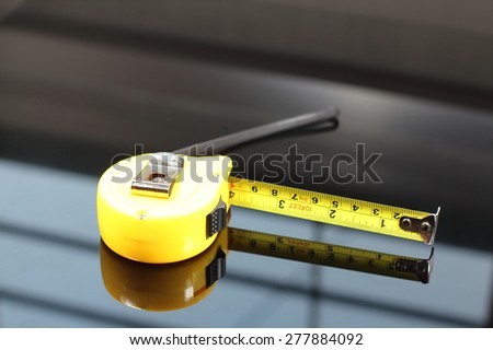 measurement tape on black background