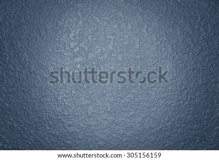 Dark blue paint textured wall closeup