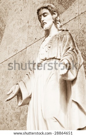 Stone Statue of Jesus Christ in a Cemetery