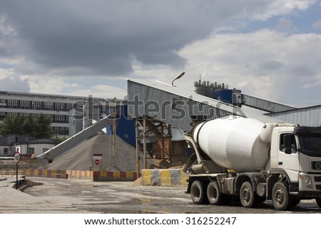 Industrial Cement Processing Plant. the foreground of a truck mixer