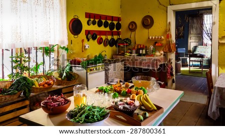 Fruits and vegetables prepared for a banquet.Typical house in the northern region of Chile