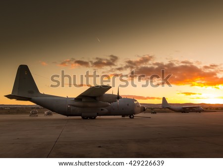 Photograph of a Hercules aircraft on land,ready to take off