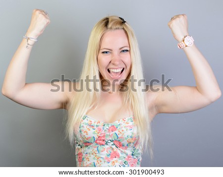 muscular athletic young woman on a gray background. Fitness. Muscular body. Torso. Abdominal muscles