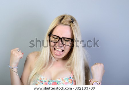 woman screaming because of winning excitement