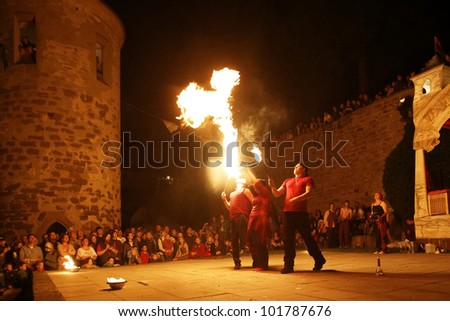 STETTENFELS, GERMANY - APRIL 30: Medieval fire show with fire dancers at the Castle Stettenfels on April 30, 2012 in Stettenfels, Germany.