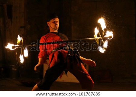STETTENFELS, GERMANY - APRIL 30: Medieval fire show with fire dancers at the Castle Stettenfels on April 30, 2012 in Stettenfels, Germany.