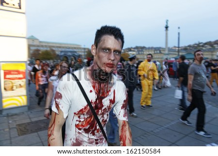 STUTTGART - OCTOBER 26: The Annual Zombie Walk Stuttgart People dress as Zombies and scare people in Stuttgart City. October 26, 2013 in Stuttgart, Germany.