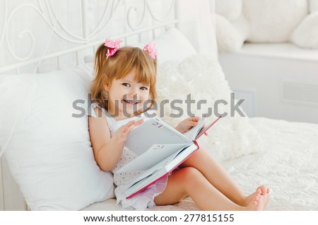 Little girl and a big book
