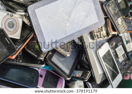 Old cellphones and battery - Electronic waste concept