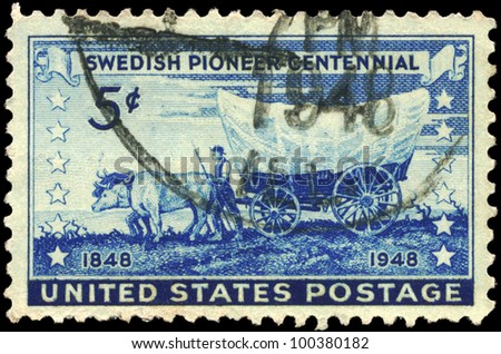 USA - CIRCA 1948: A stamp printed in USA shows the Pioneer with Covered Wagon moving Westward, Swedish Pioneer Issue, circa 1948