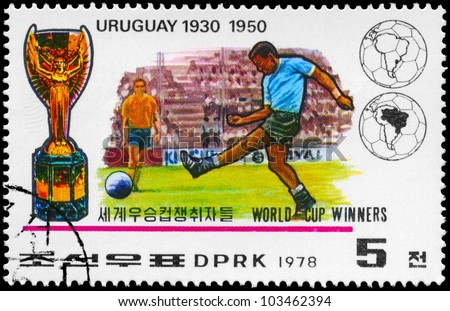 NORTH KOREA - CIRCA 1978: A Stamp printed in NORTH KOREA shows the Soccer players, Cup and Globe, Uruguay (1930, 1950), World Cup Winners, circa 1978