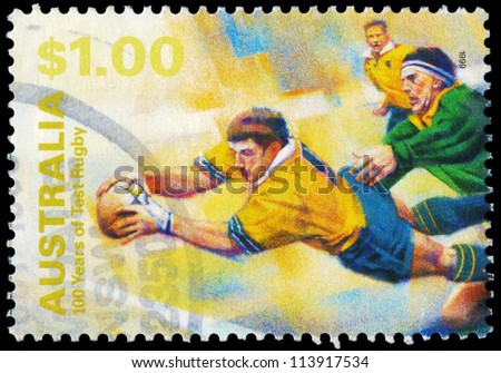 AUSTRALIA - CIRCA 1999: A Stamp printed in AUSTRALIA shows the Diving with ball, 100 Years of Test Rugby, series, circa 1999