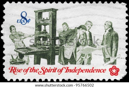 USA - CIRCA 1973: A Stamp printed in USA shows the Printer and Patriots examining Pamphlet, from the series \