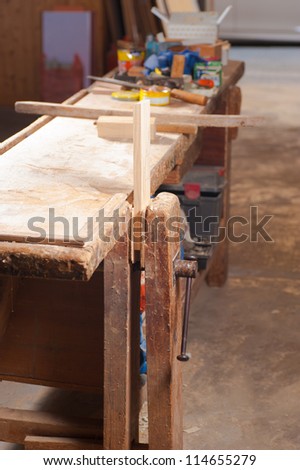 An old wooden work bench in a carpenter workshop