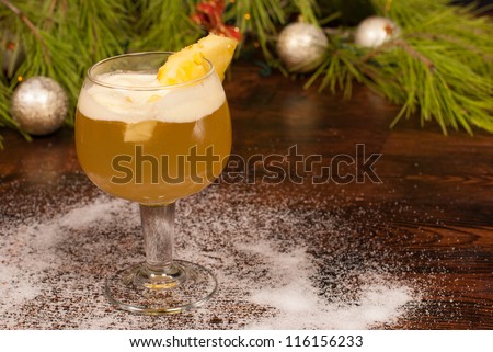 Christmas cocktail surrounded by festive decoration