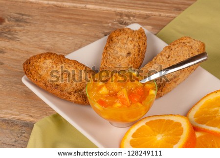 Healthy breakfast with whole wheat toasts and  homemade orange marmelade
