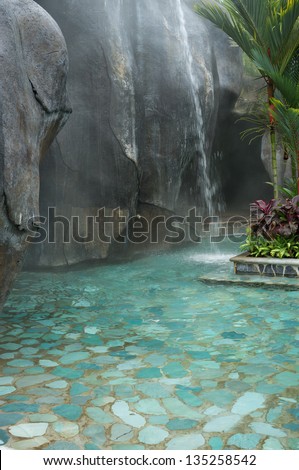 Hot springs waterfall in a thermal spa