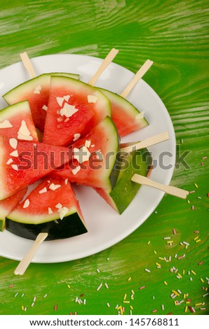 Fake ice lollies made with slices of watermelon,  healthy kid food