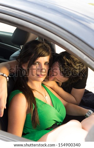 Romantic scene with a couple inside a car