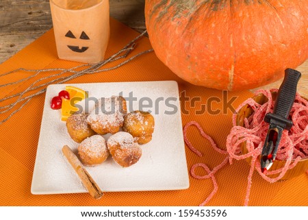 A traditional sweet Halloween dessert served  with holiday decoration.