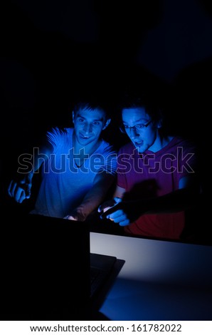 Two guys in front of a computer screen