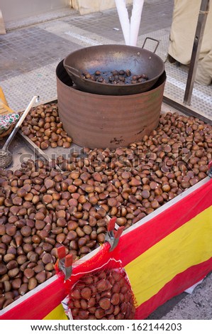 Chestnuts being roasted on a street food stall