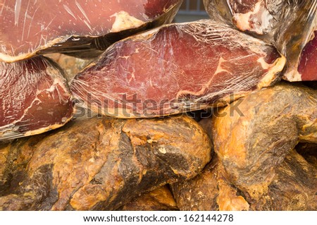 Full frame take of pieces of Spanish serrano ham  for sale on a market stall