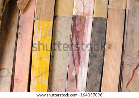 Full frame take of  a stack of old painter canvases
