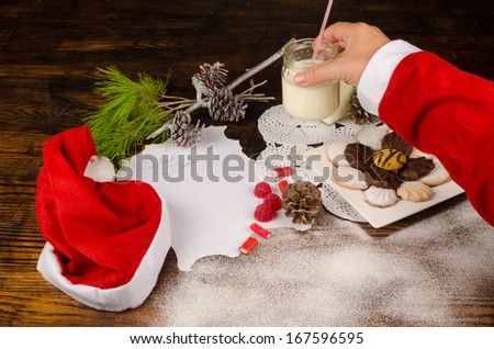 Santas hand taking treats  prepared for him
