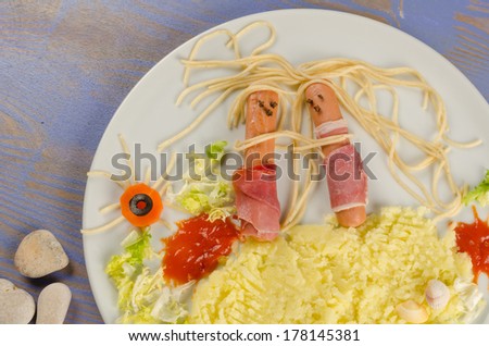 Summer kid food displaying a sausage couple on the beach