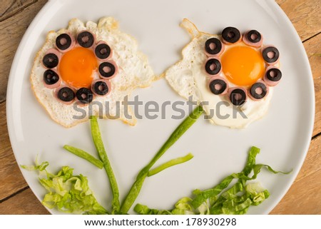 Fried egg in the shape of fancy flowers, kid food