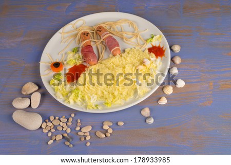 Summer kid food displaying a sausage couple on the beach
